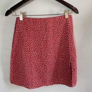 beautifully patterned mini skirt with a small slit